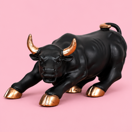 Handcrafted matte black and gold charging bull statue for home decor and office desk display