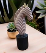 Abstract horse head sculpture with ribbed beige finish and black base by Elysee Decor