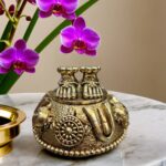 Brass Lakshmi Charan Paduka with antique finish and sacred motifs by Elysee Decor